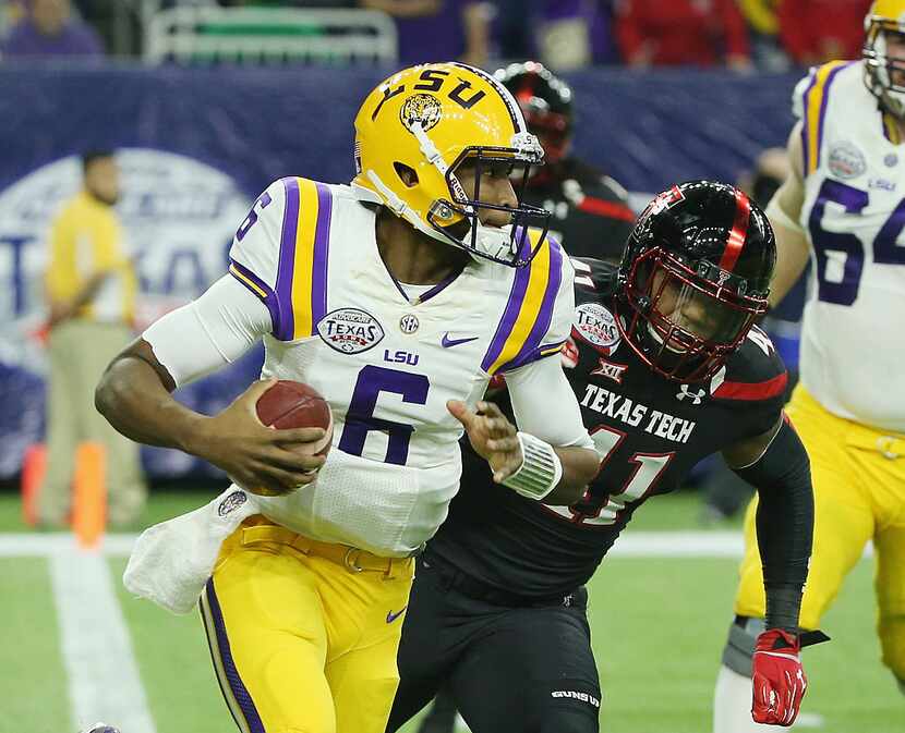 HOUSTON, TX - DECEMBER 29: Brandon Harris #6 of the LSU Tigers runs with the football past...