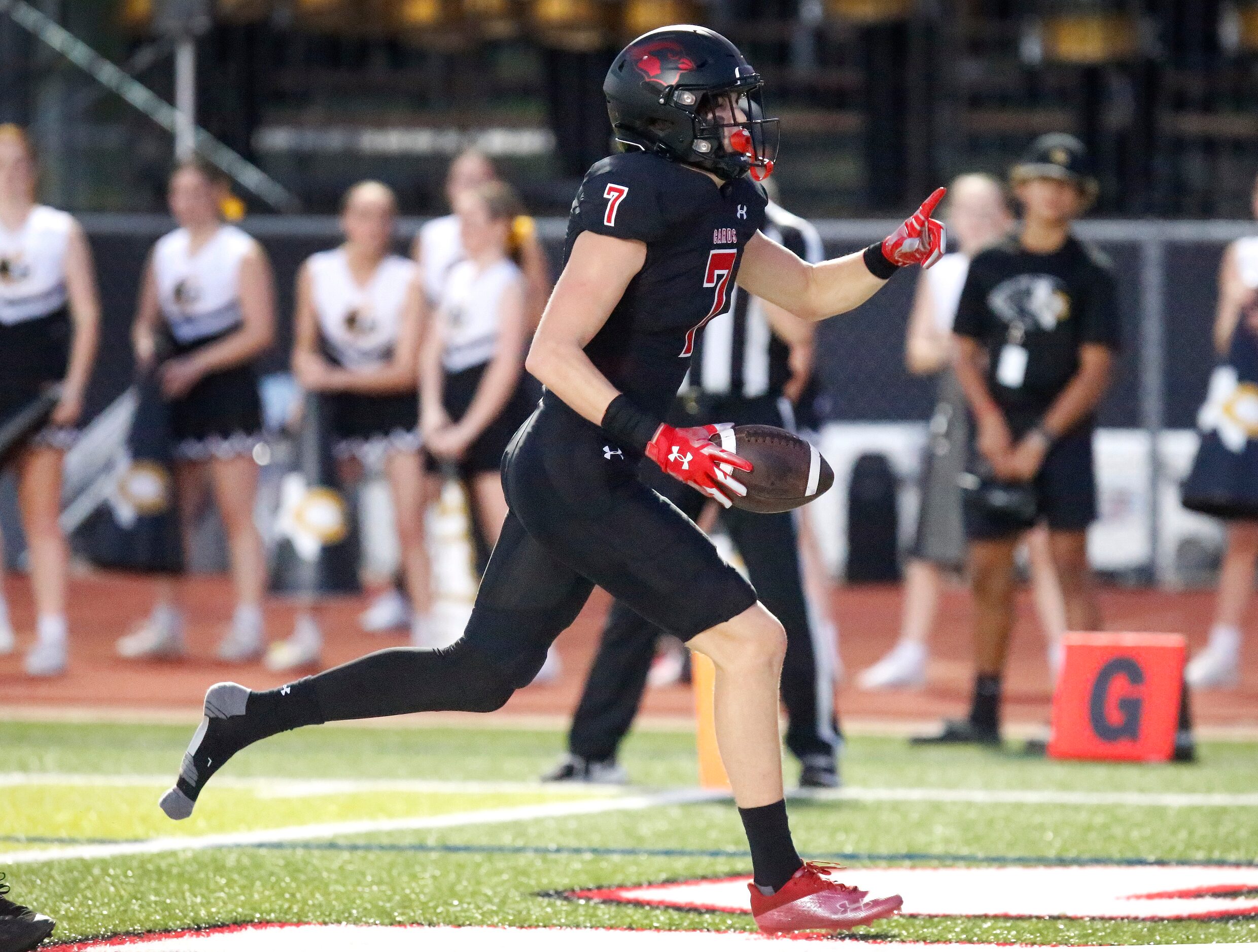 Melissa High School tight end Gunnar Wilson (7) scores a touchdown despite losing his shoe...