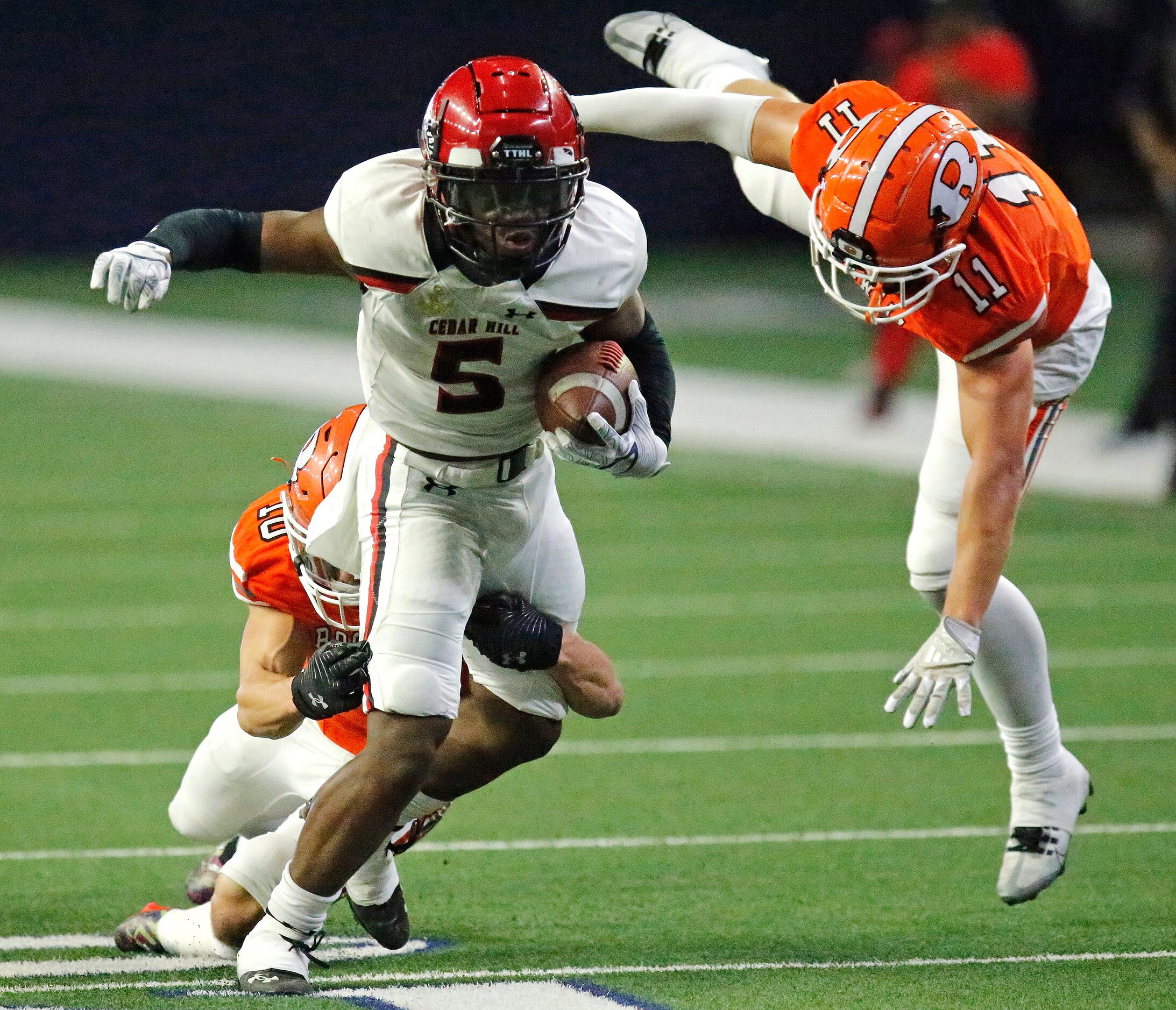 Rockwall High School safety Brendon Ross (10) and Rockwall High School free safety Jake...