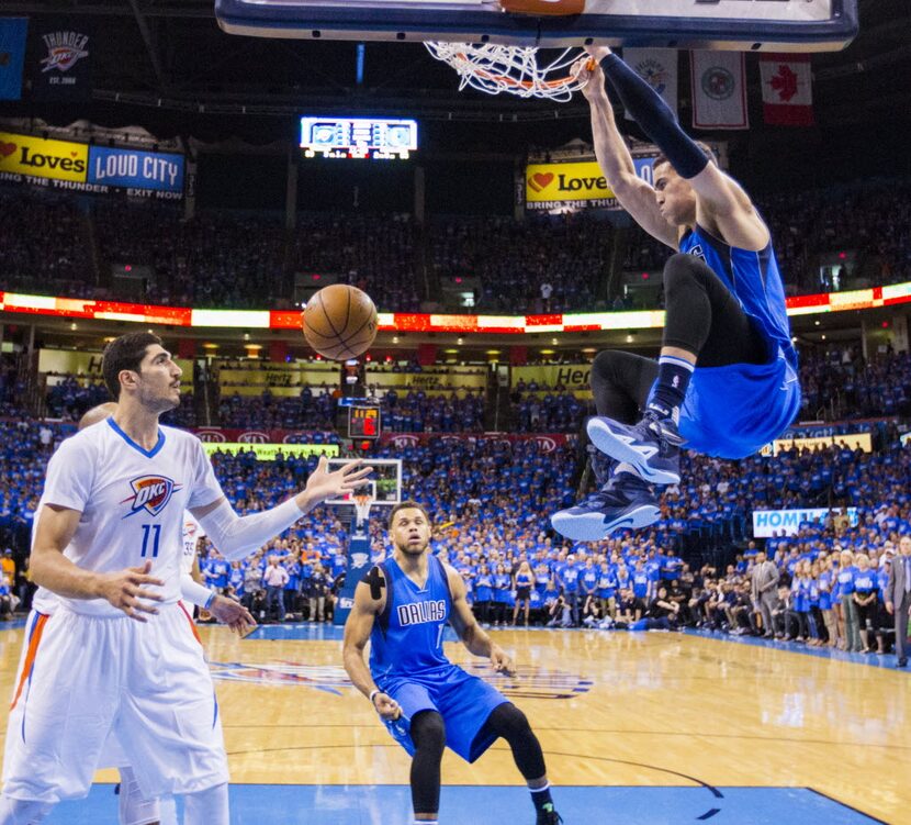 Dallas Mavericks forward Dwight Powell (7) dunks the ball during the third quarter of game 5...