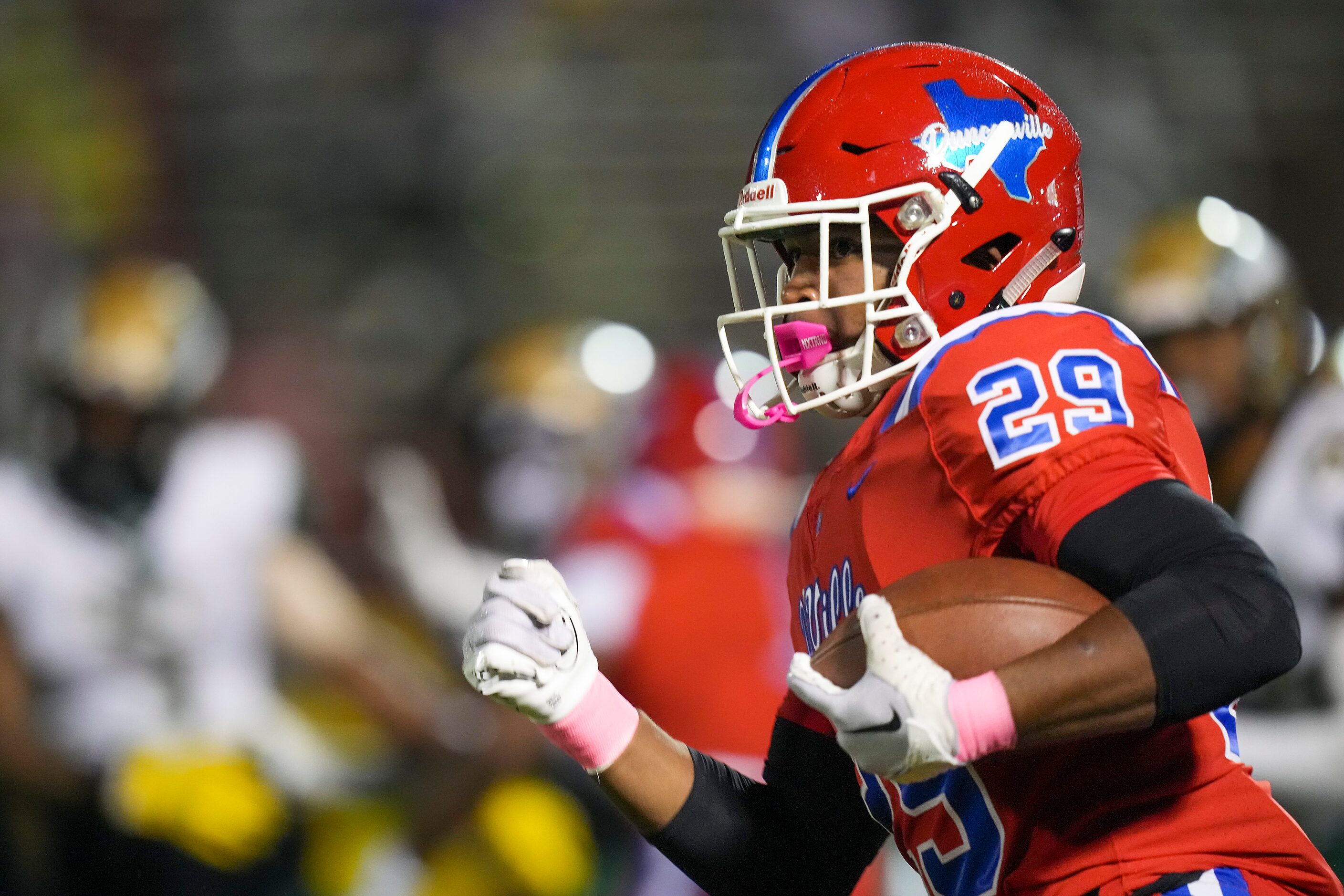 Duncanville running back Caden Durham (29) breaks free of the DeSoto defense on a 92-yard...