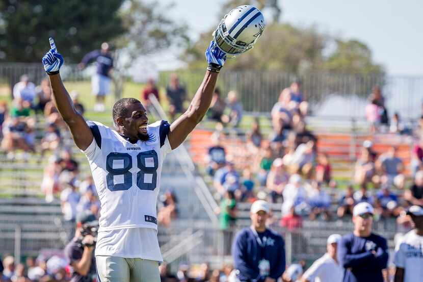 Cowboys wide receiver Dez Bryant (88) cheers a catch by fellow wide receiver Reggie Dunn...