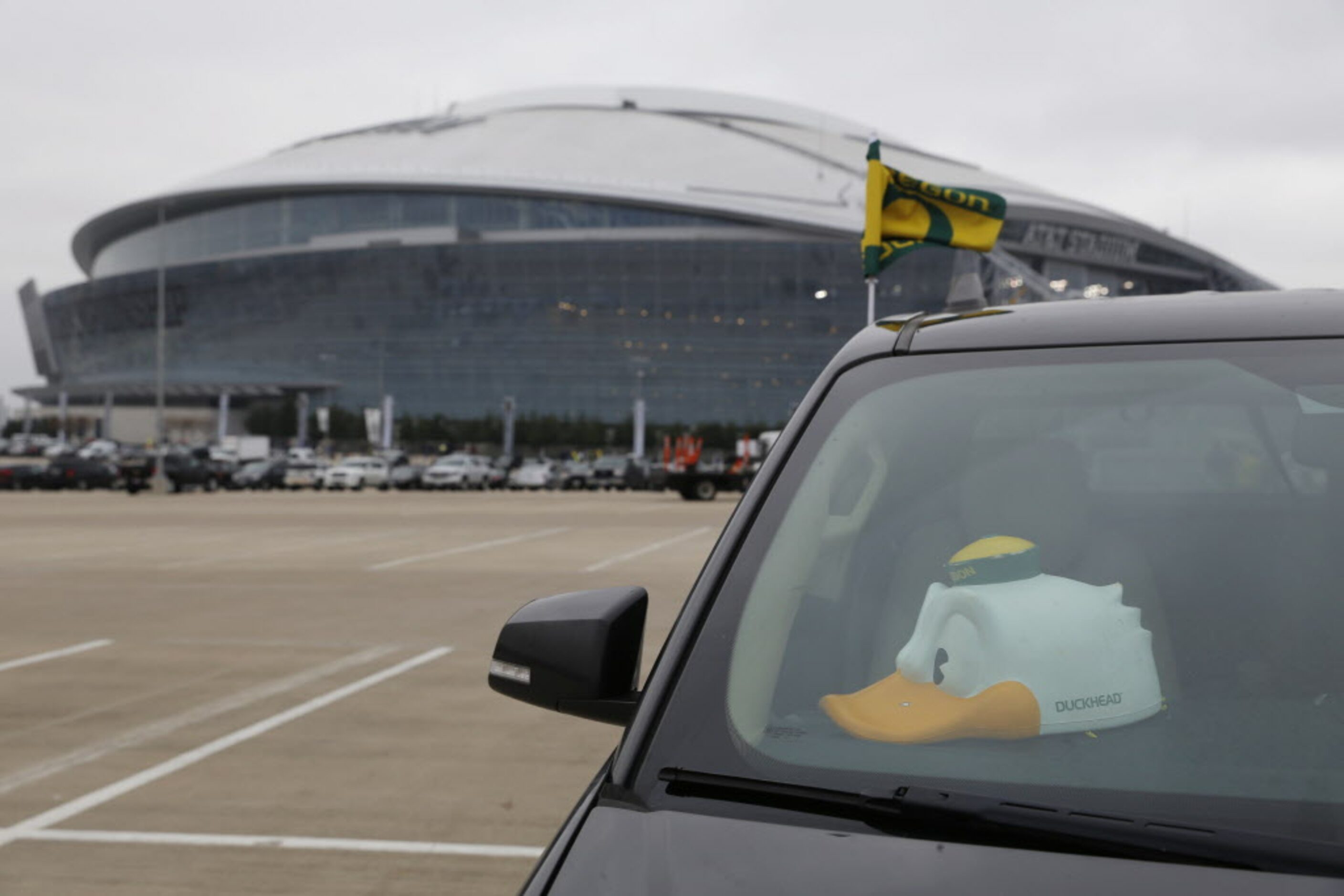 An Oregon Ducks hat sits in a car before the College Football Playoff National Championship...