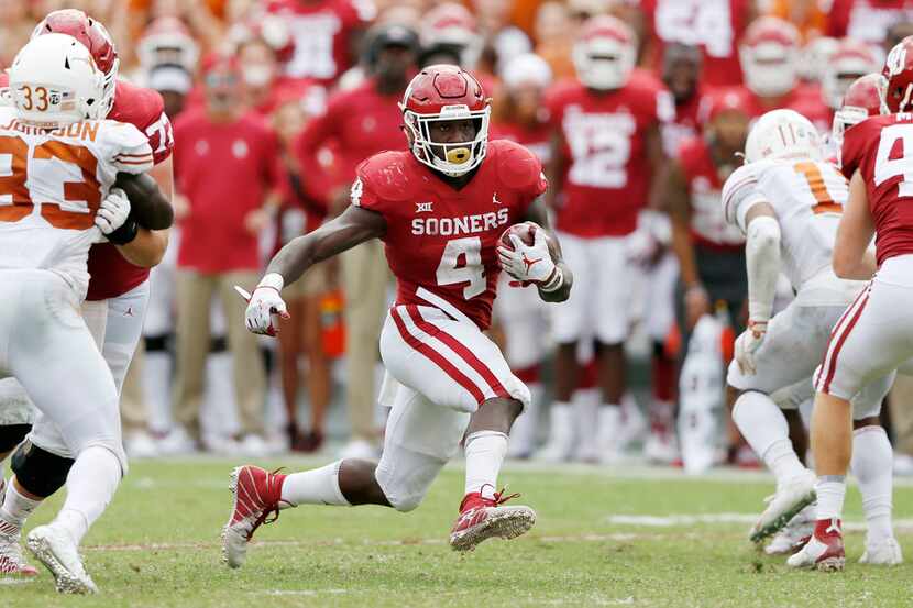 Oklahoma Sooners running back Trey Sermon (4) rushes up the field during the second half of...