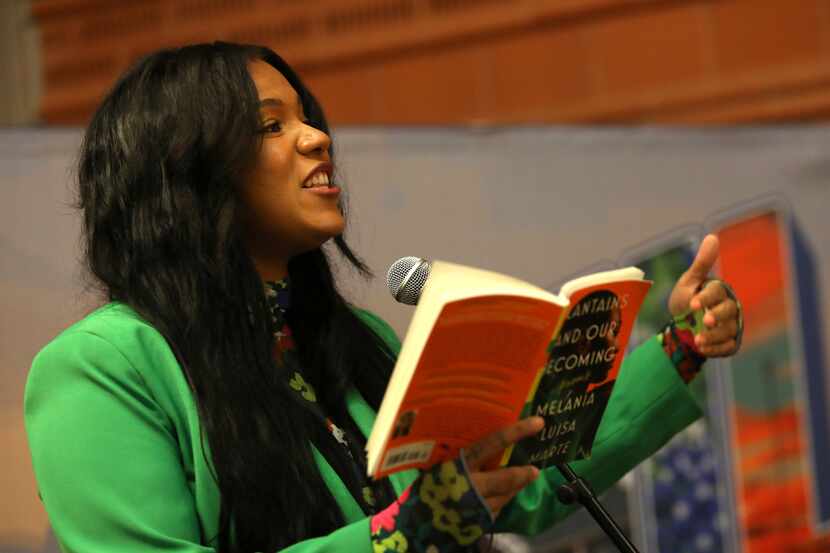 Melania Luisa Marte reads from her book during an event at the Cedar Hill Government Center...