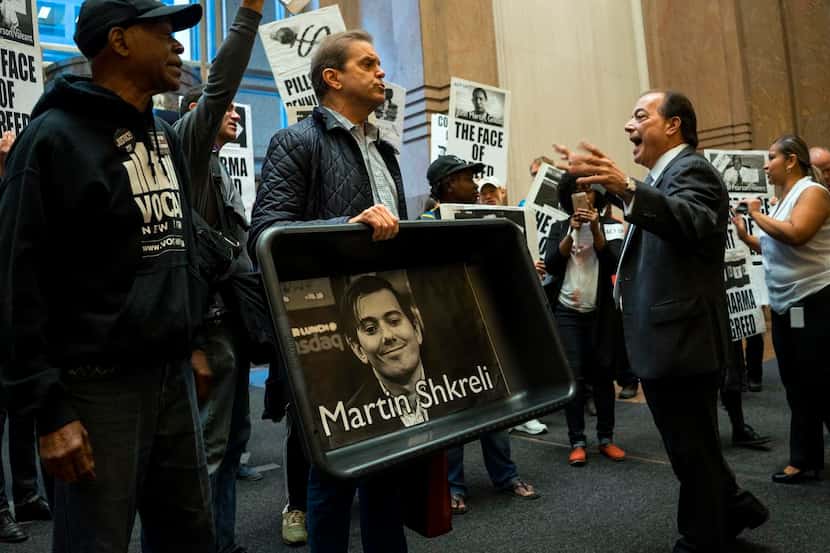 
Carrying an image of Turing Pharmaceuticals CEO Martin Shkreli in a makeshift cat litter...