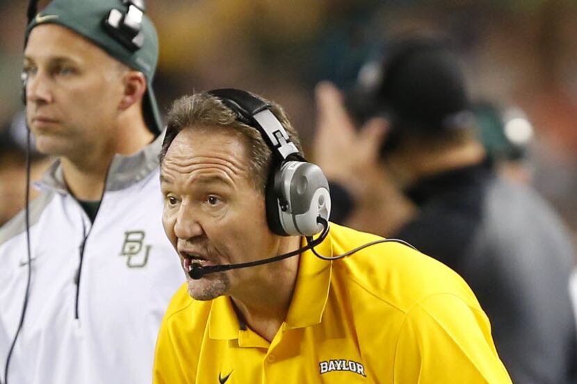 Baylor Bears defensive coordinator Phil Bennett yells to his players  in the first half...