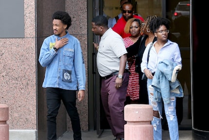 Bobby Sessions (left) and his relatives exit the Earle Cabell Federal Building in Dallas on...