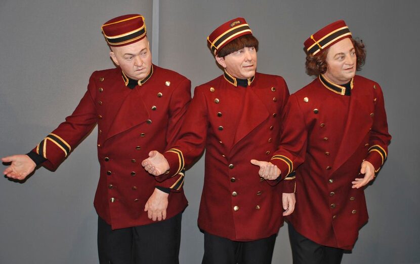 Wax figures  of Curly, Moe and Larry, dressed as bellboys, bow in welcome to visitors at the...