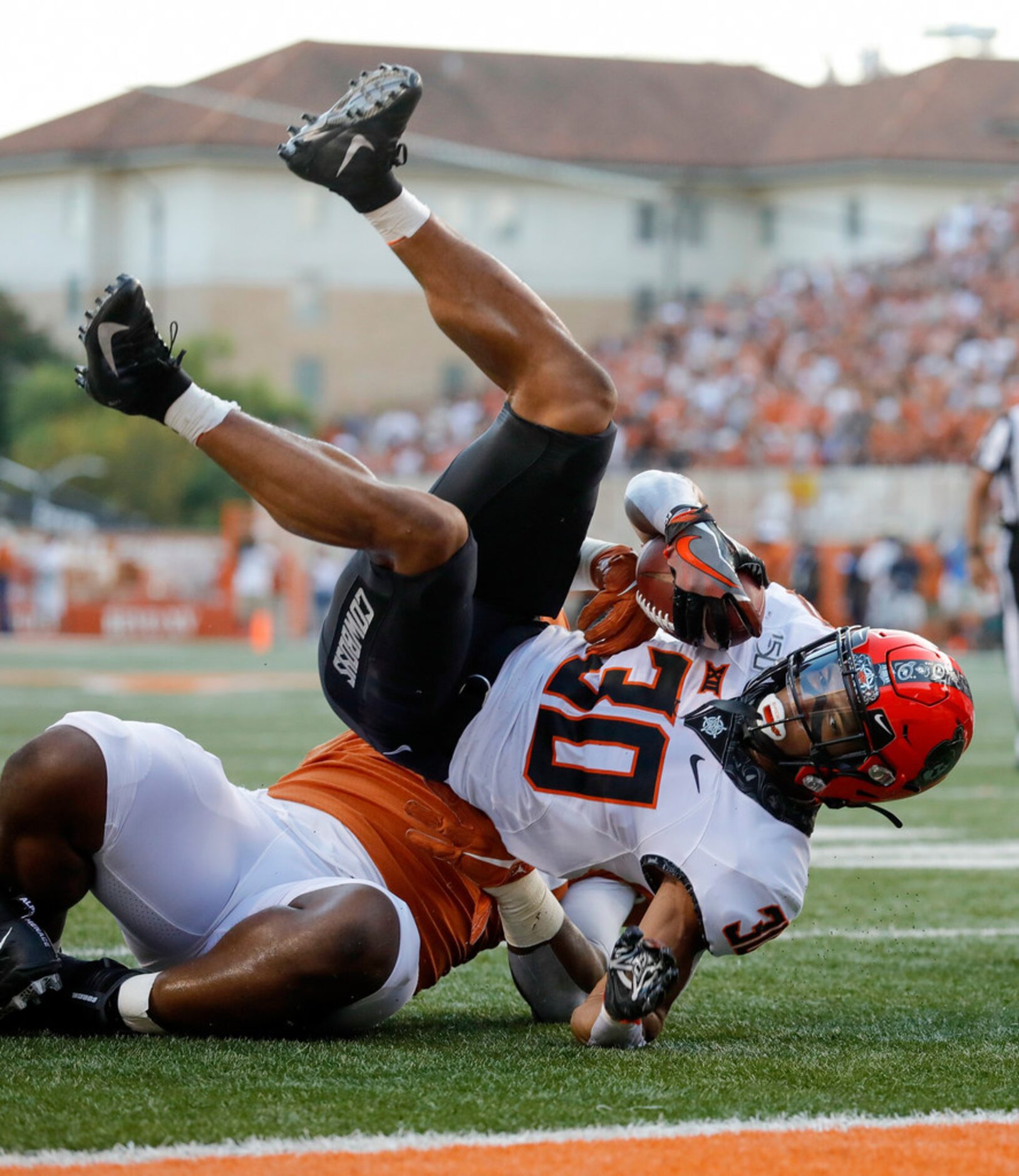 AUSTIN, TX - SEPTEMBER 21:  Chuba Hubbard #30 of the Oklahoma State Cowboys is tackled short...