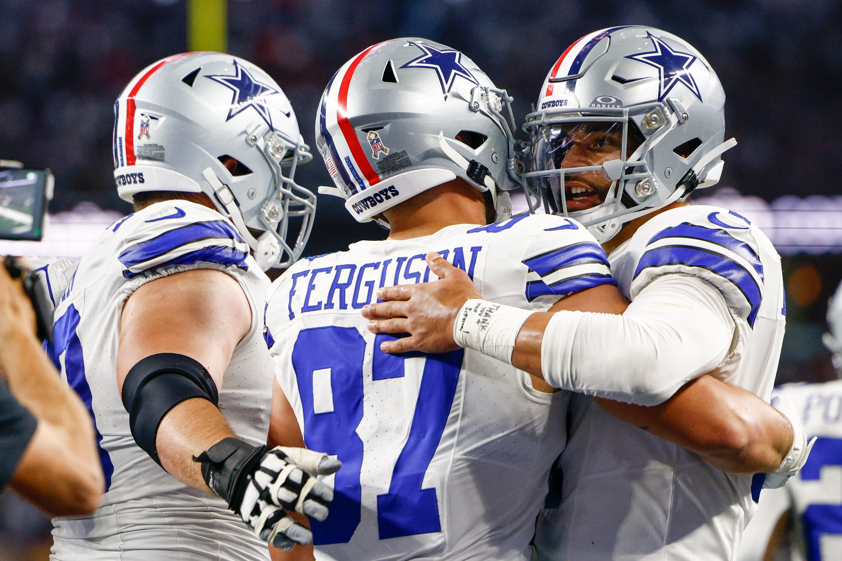 Dallas Cowboys tight end Jake Ferguson (87) celebrates his touchdown with quarterback Dak...