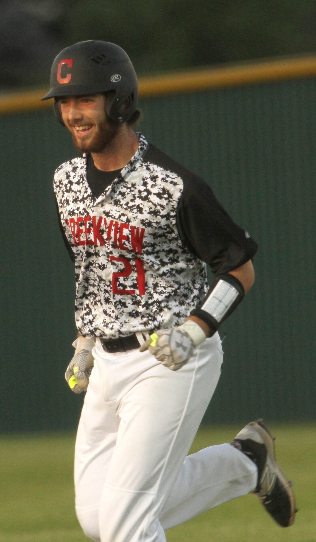 Carrollton Creekview catcher Grayson McCown (21) was all smiles as he is replaced by a pinch...