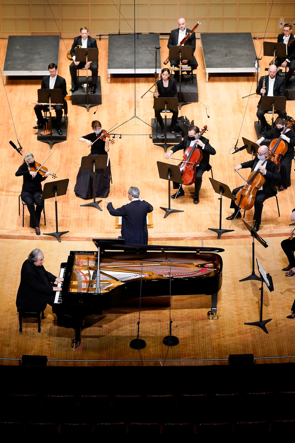 Music director Fabio Luisi conducts a socially distanced symphony, with pianist Yefim...