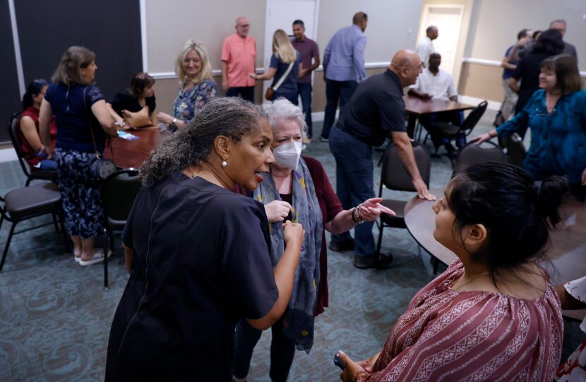 Candidate for Tarrant County Judge, Deborah Peoples (left), visits with constituents during...