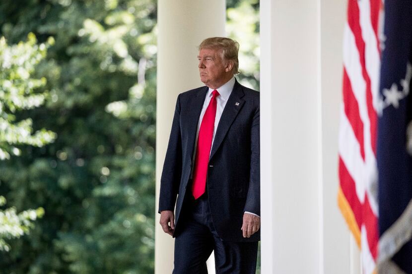 President Donald Trump arrives to speak about the U.S. role in the Paris climate change...