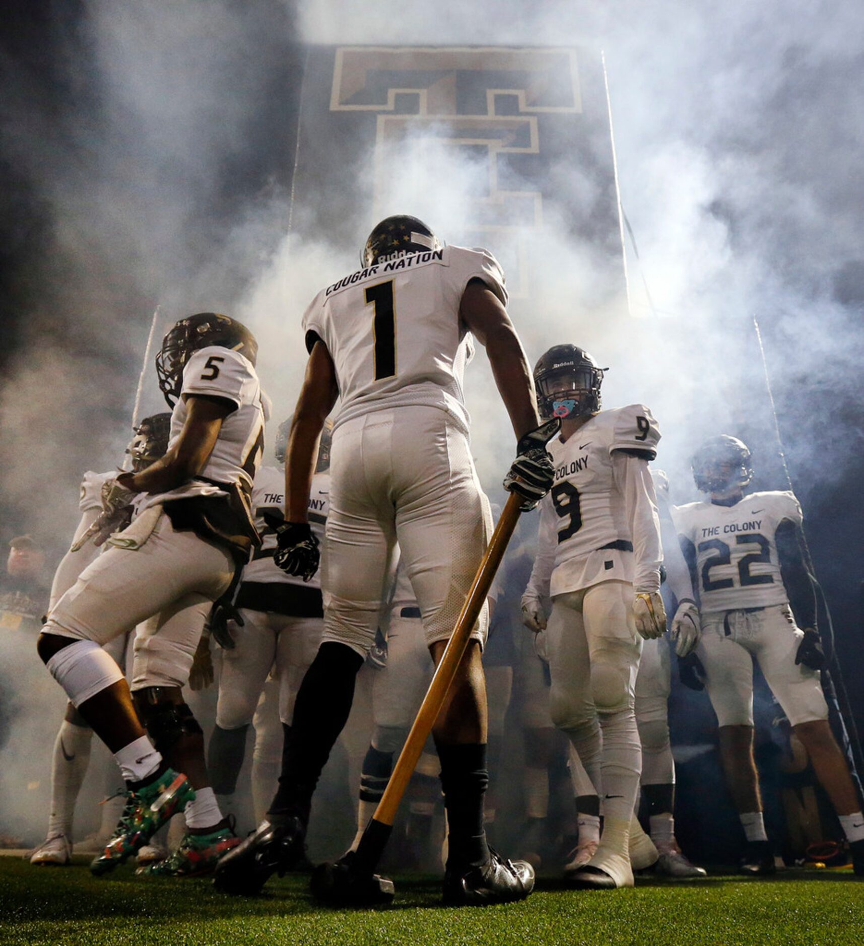 With a sledge hammer in hand, The Colony's Myles Price (1) gets his teammates fired up...