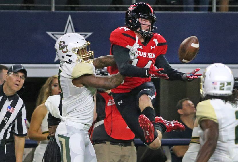 Texas Tech Red Raiders wide receiver Dylan Cantrell (14) makes a great effort but can't haul...