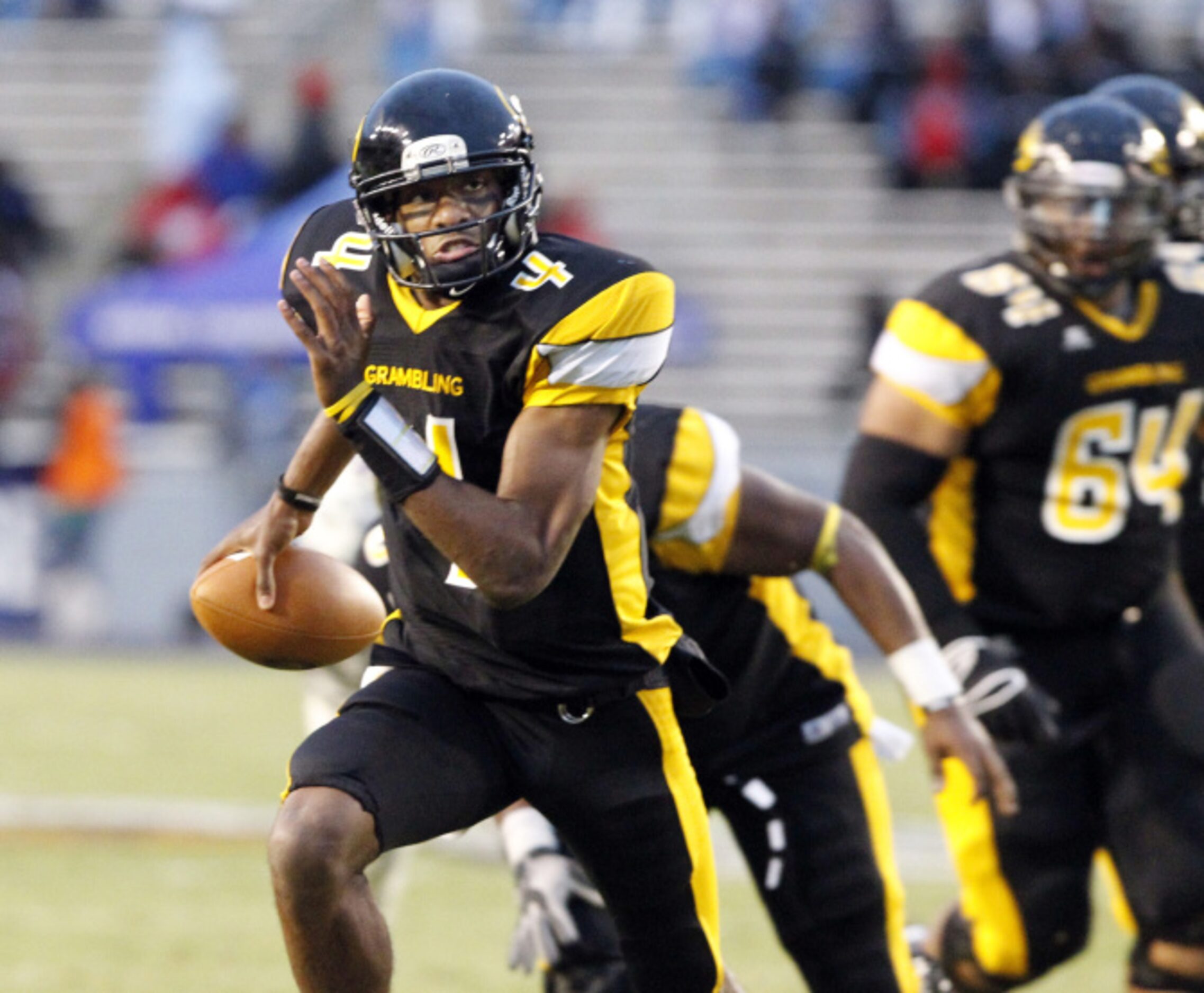 Grambling quarterback D.J. Williams (4) scrambles for a touchdown during the first half of a...