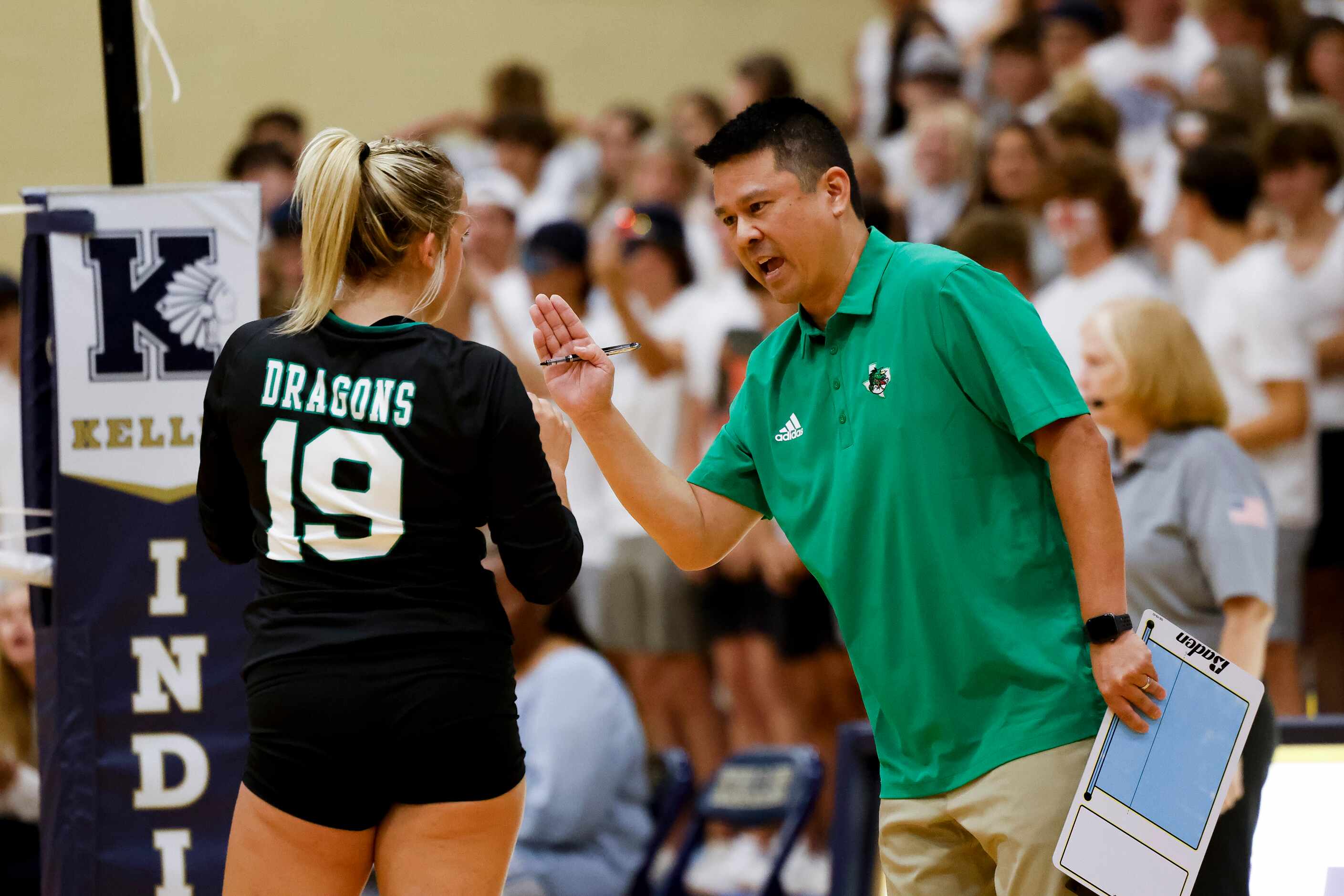 Southlake Carroll’s coach Jason Tanaka talks to player  during the first set of a 4-6A...