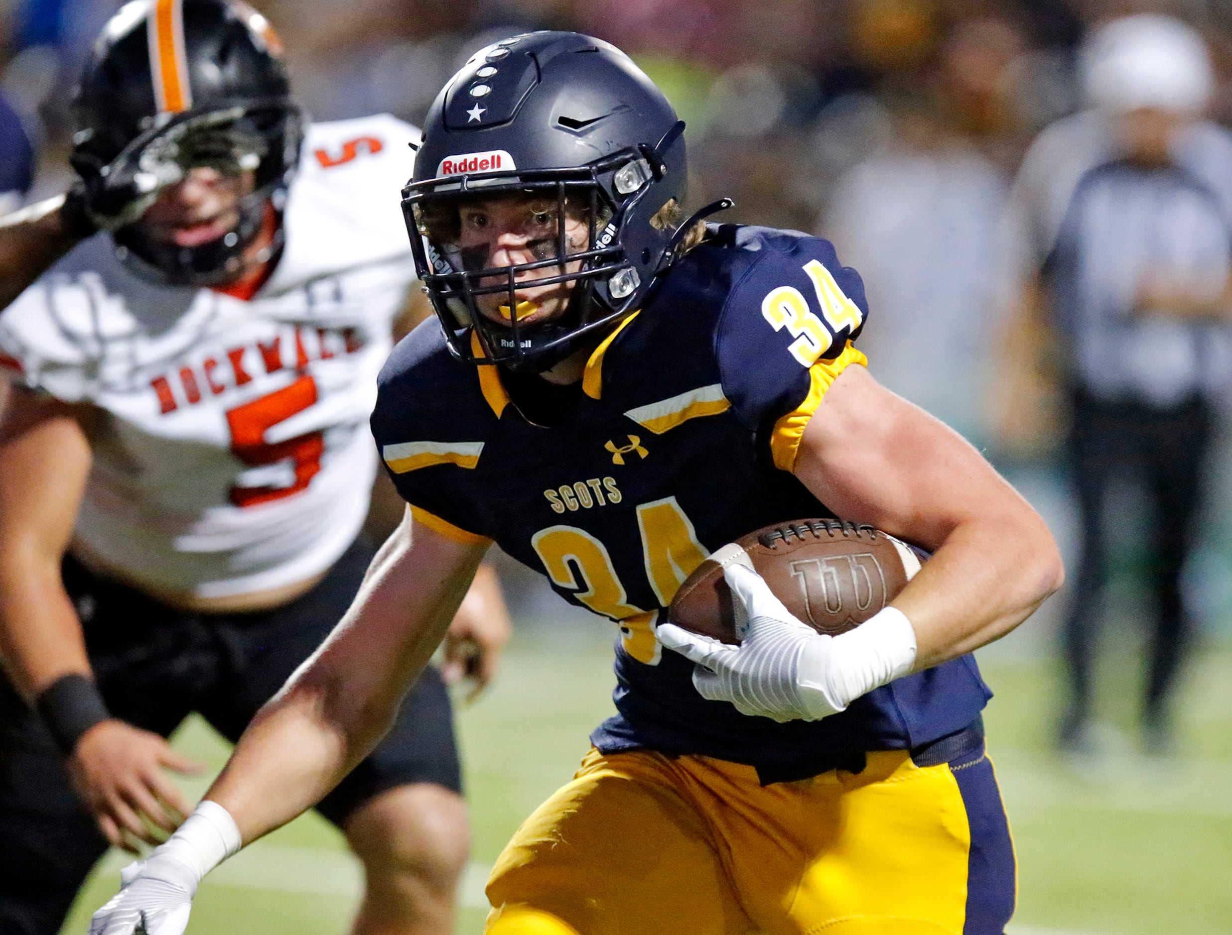 Highland Park High School running back Ben Croasdale (34) carries the ball to the end zone...