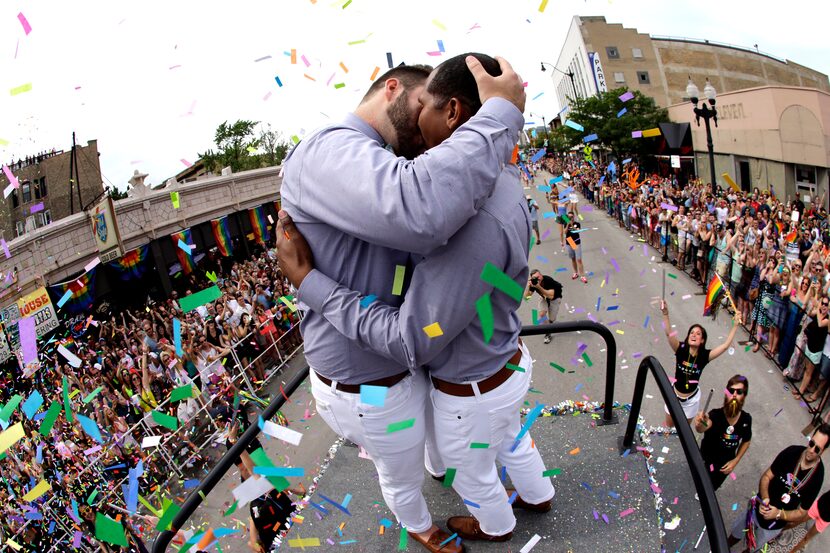 Roger Kmight, 32, of Chicago, as they get married during the Chicago Pride Parade on...