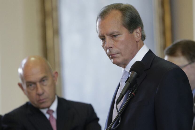 Lt. Gov. David Dewhurst (right), conferred with senators over a point of order during...