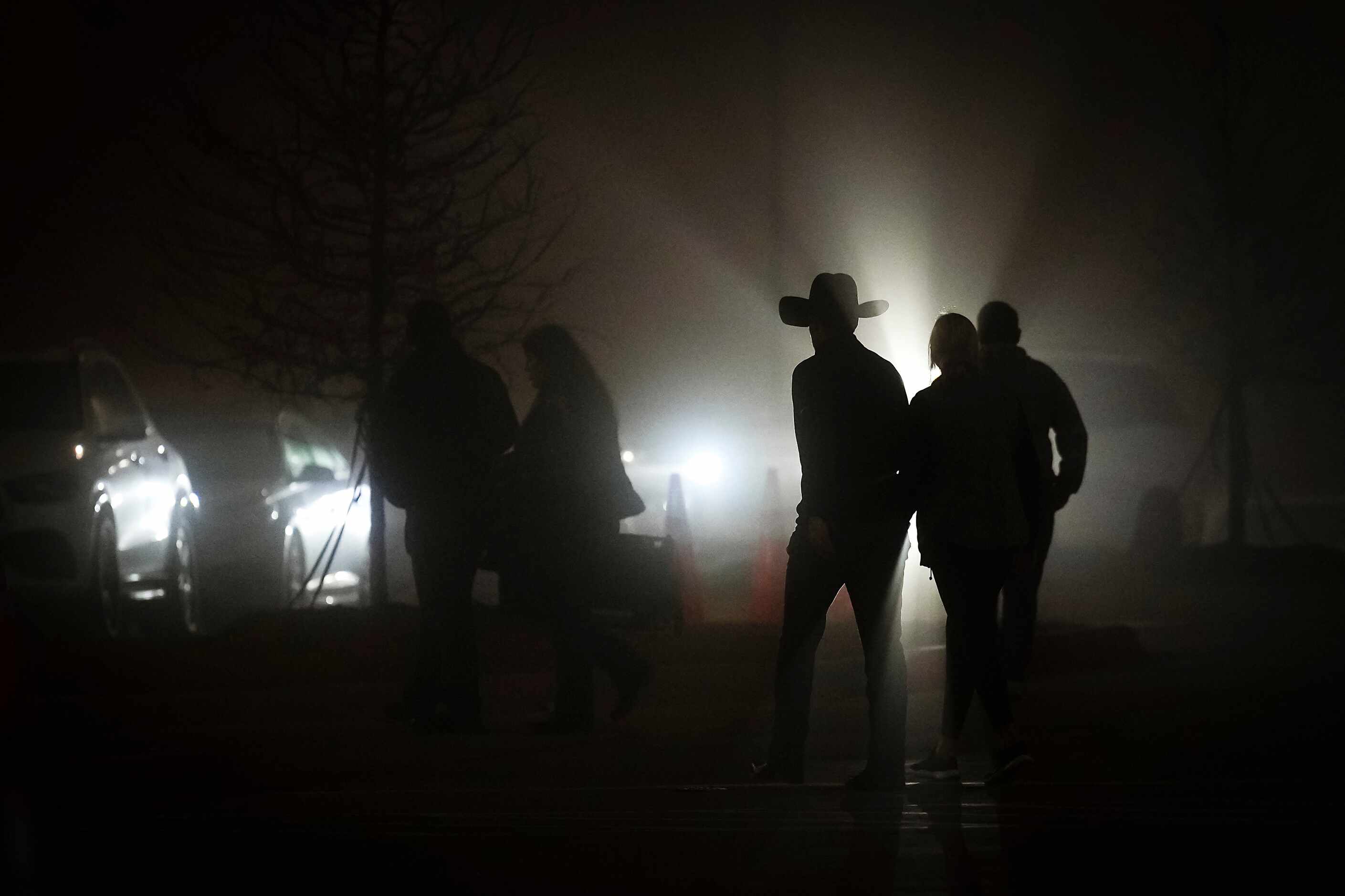 Argyle fans head to their cars as fog shrouds the parking lot following a loss to South Oak...