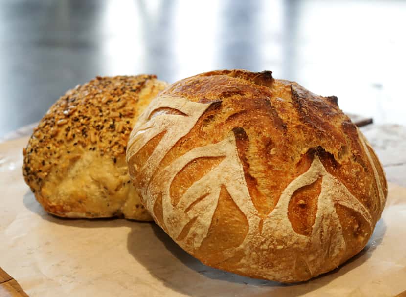 The Seeded Semolina, left, and Einkorn Mesquite sourdough bread offered by Girl With Flour...