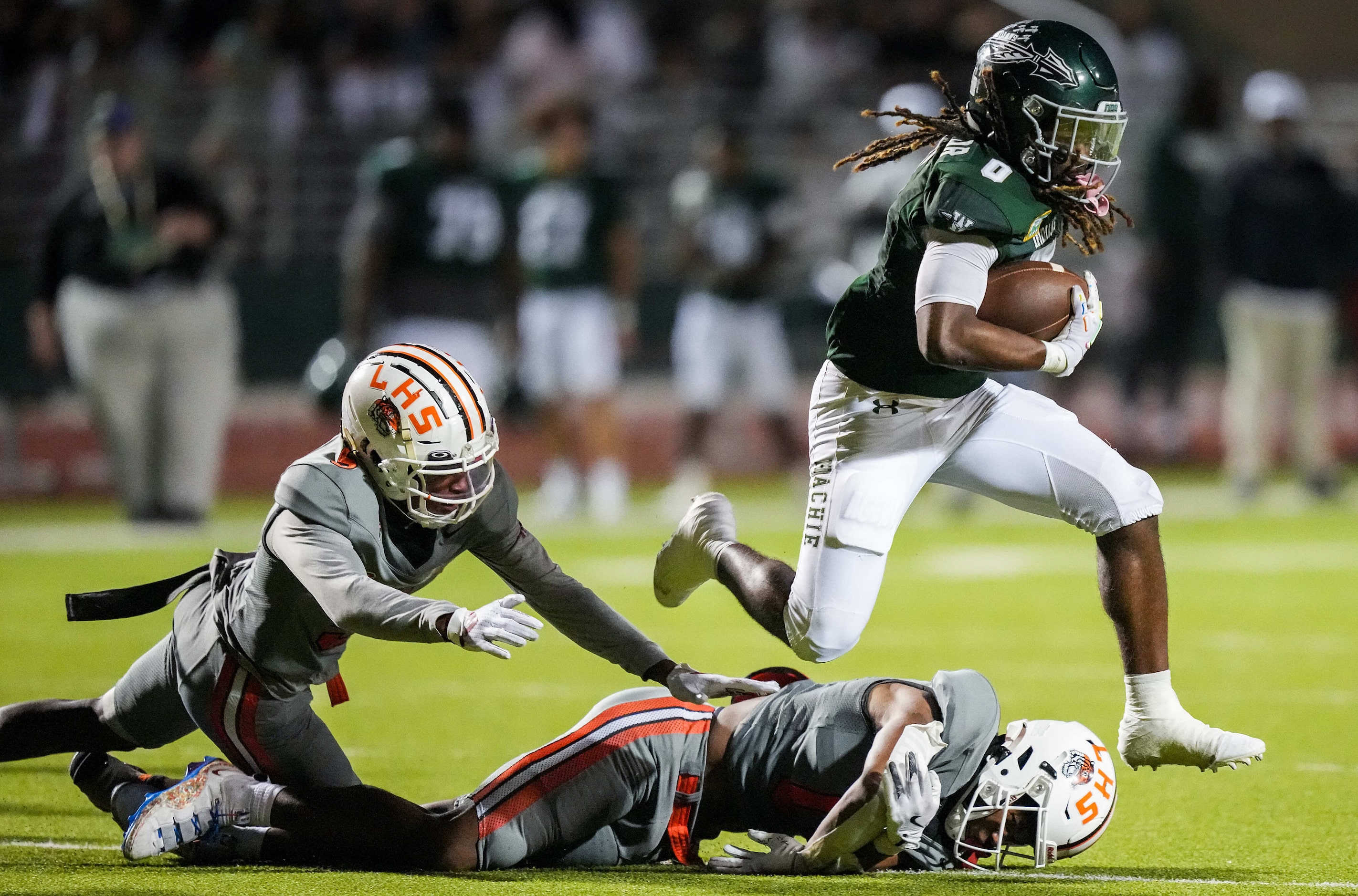 Waxahachie running back Bryson Linnear (0) gets past Lancaster linebacker Ke’Breion Winston...