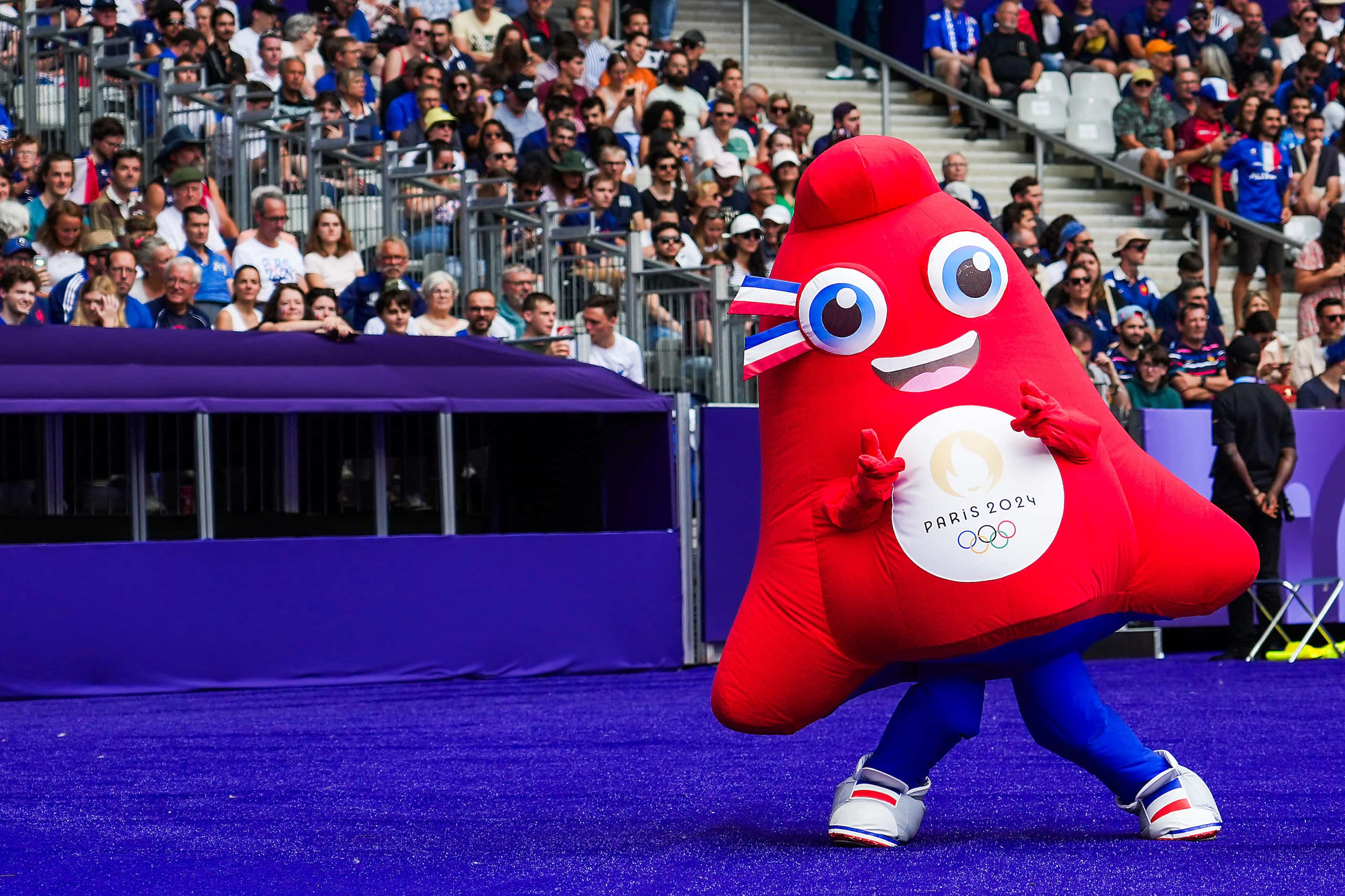 The Paris 2024 Olympic mascot, Phryge, entertains fans between men’s rugby sevens pool...