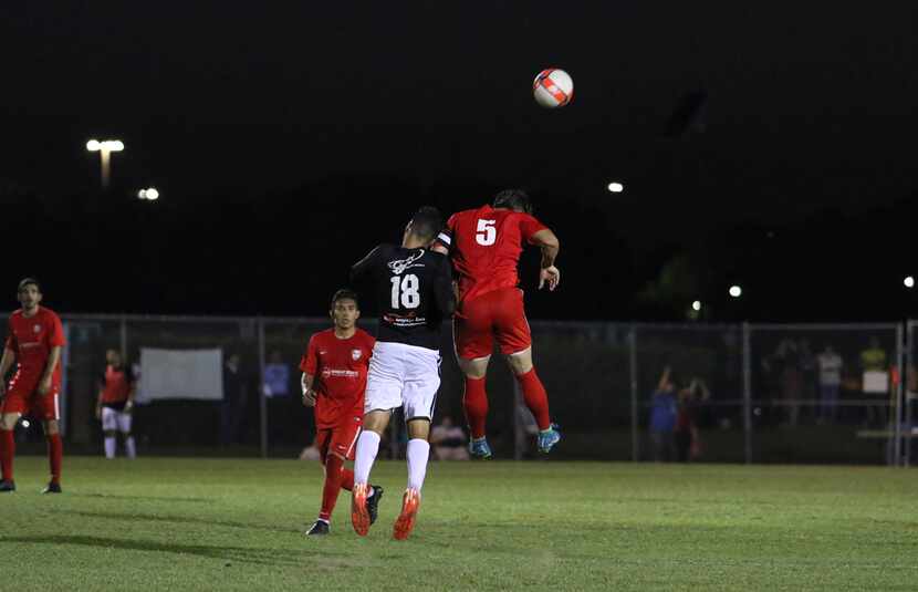 Adrian Ramos (18) of NTX Rayados and Leo Sosa (5) of FC Wichita battle for a header in their...