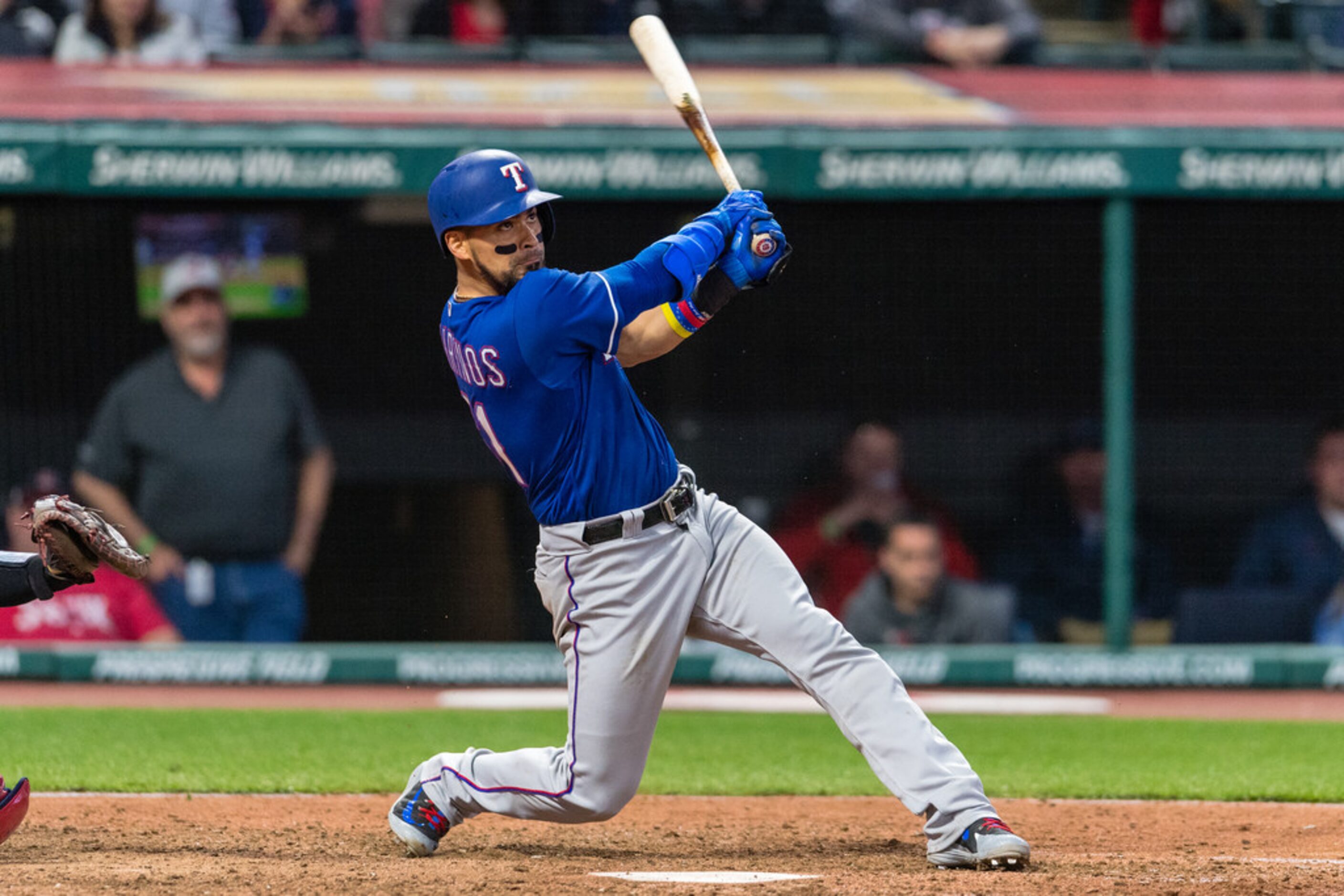 CLEVELAND, OH - APRIL 30: Robinson Chirinos #61 of the Texas Rangers hits a solo home run...