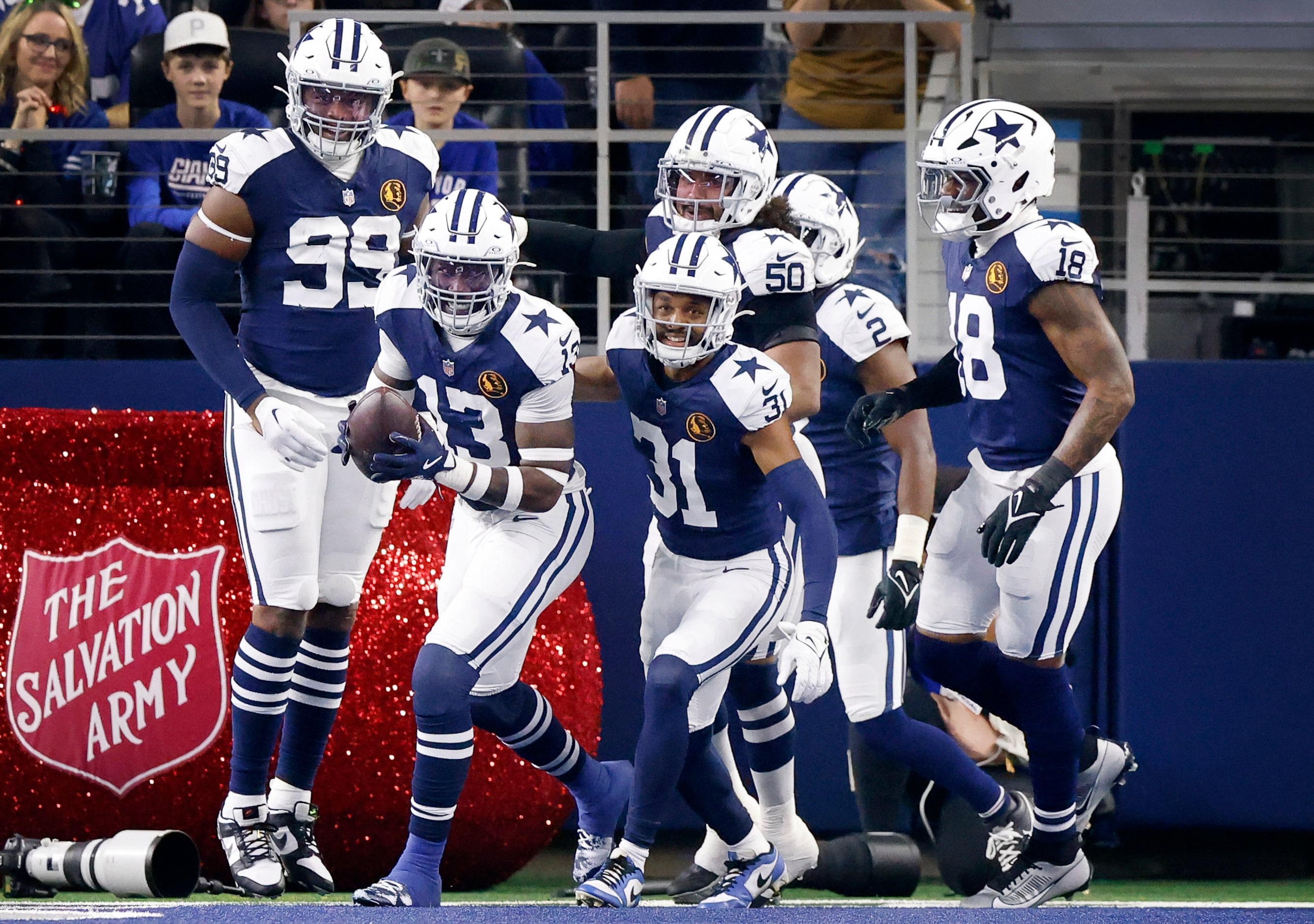 Dallas Cowboys linebacker DeMarvion Overshown (13) celebrates his interception he ran in for...