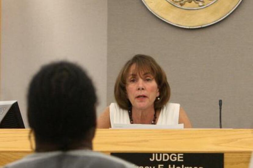 
State District Judge Tracy Holmes said she saw probation officers mishandling cases in her...
