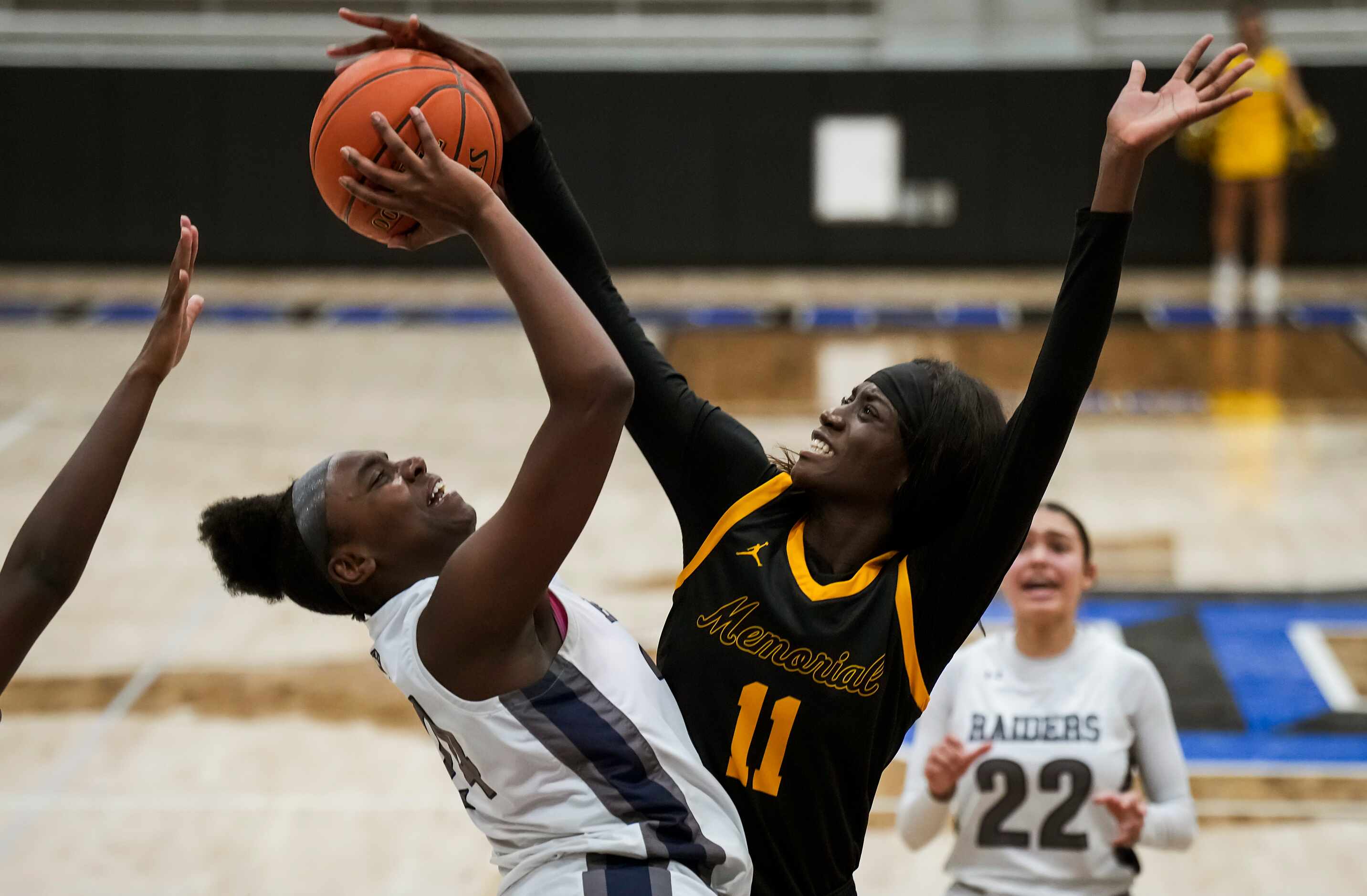 Wylie East's LeAire Nicks (24) is fouled by Frisco Memorial's Falyn Lott (11) during a Class...
