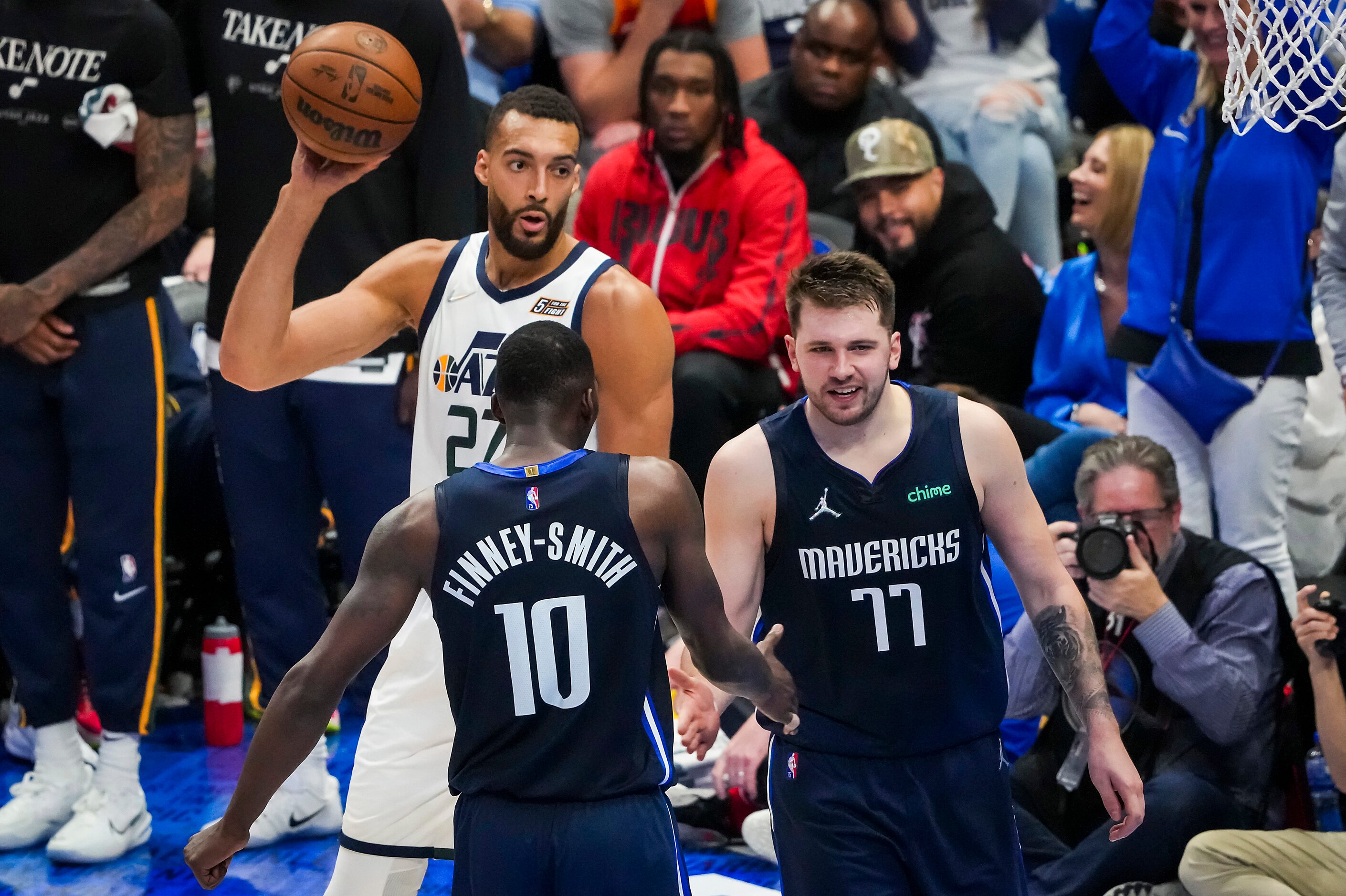 Dallas Mavericks guard Luka Doncic (77) celebrates with forward Dorian Finney-Smith (10)...