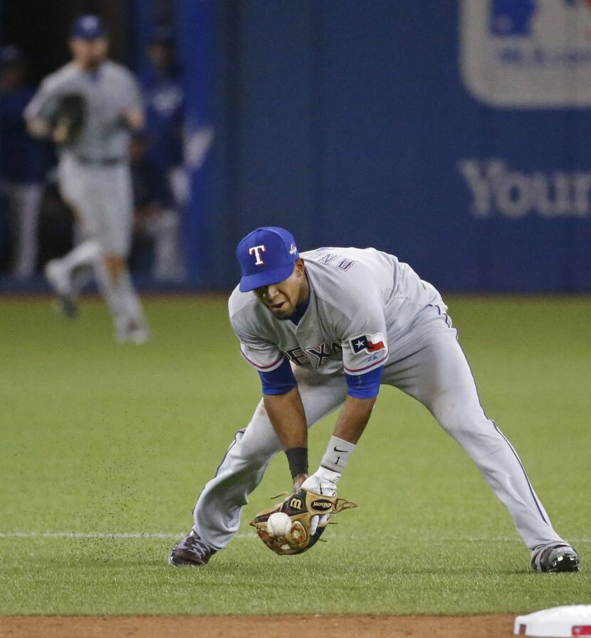 Texas Rangers shortstop Elvis Andrus (1) makes the first error in the disastrous seventh...