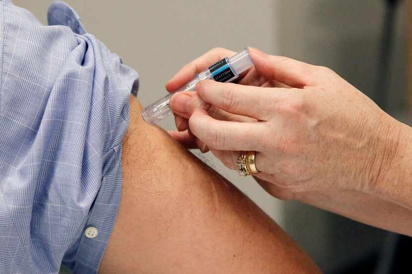 FILE - This Oct. 17, 2012 file photo shows a flu shot administered in Jackson, Miss. More...