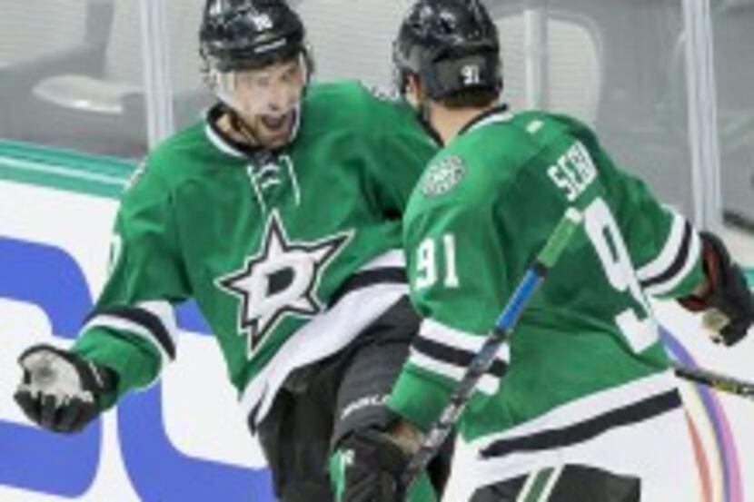  Stars left wing Patrick Sharp celebrates with Tyler Seguin after scoring during the second...