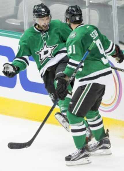  Stars left wing Patrick Sharp celebrates with Tyler Seguin after scoring during the second...