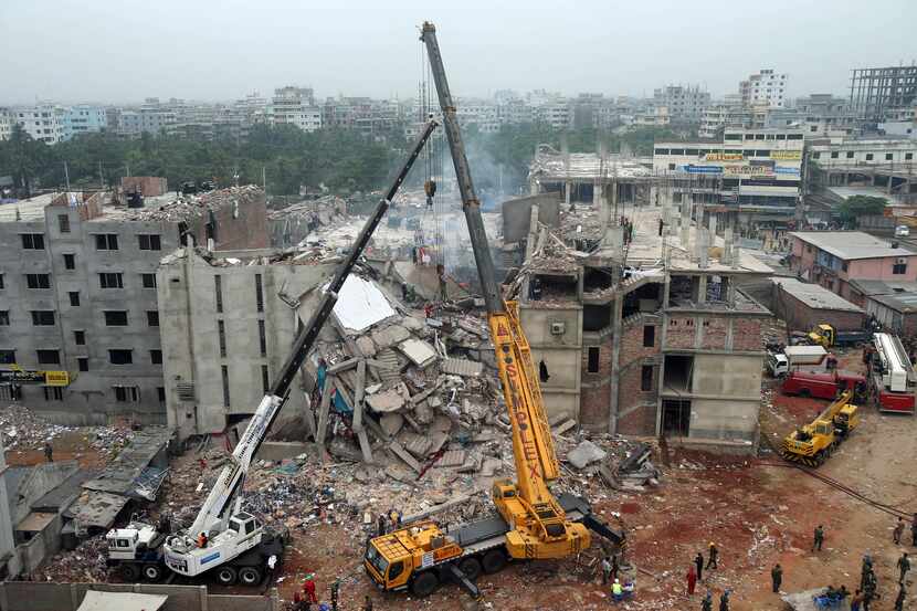  FILE - In this April 29, 2013 file photo, the collapsed Rana Plaza garment factory building...