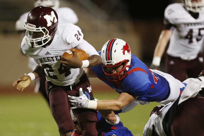 Mesquite running back Chance Fisher (24) rushes the ball in the first half during a high...