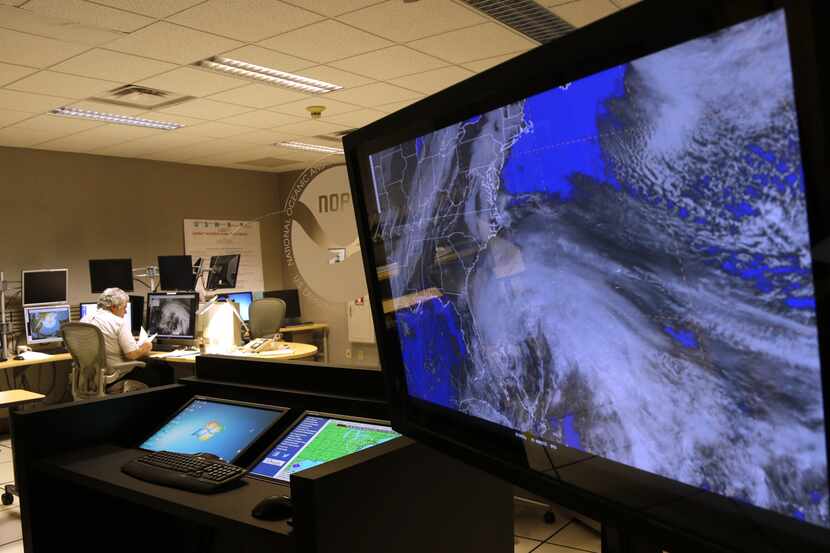 A satellite image of Hurricane Sandy is shown on a computer screen at the National Hurricane...