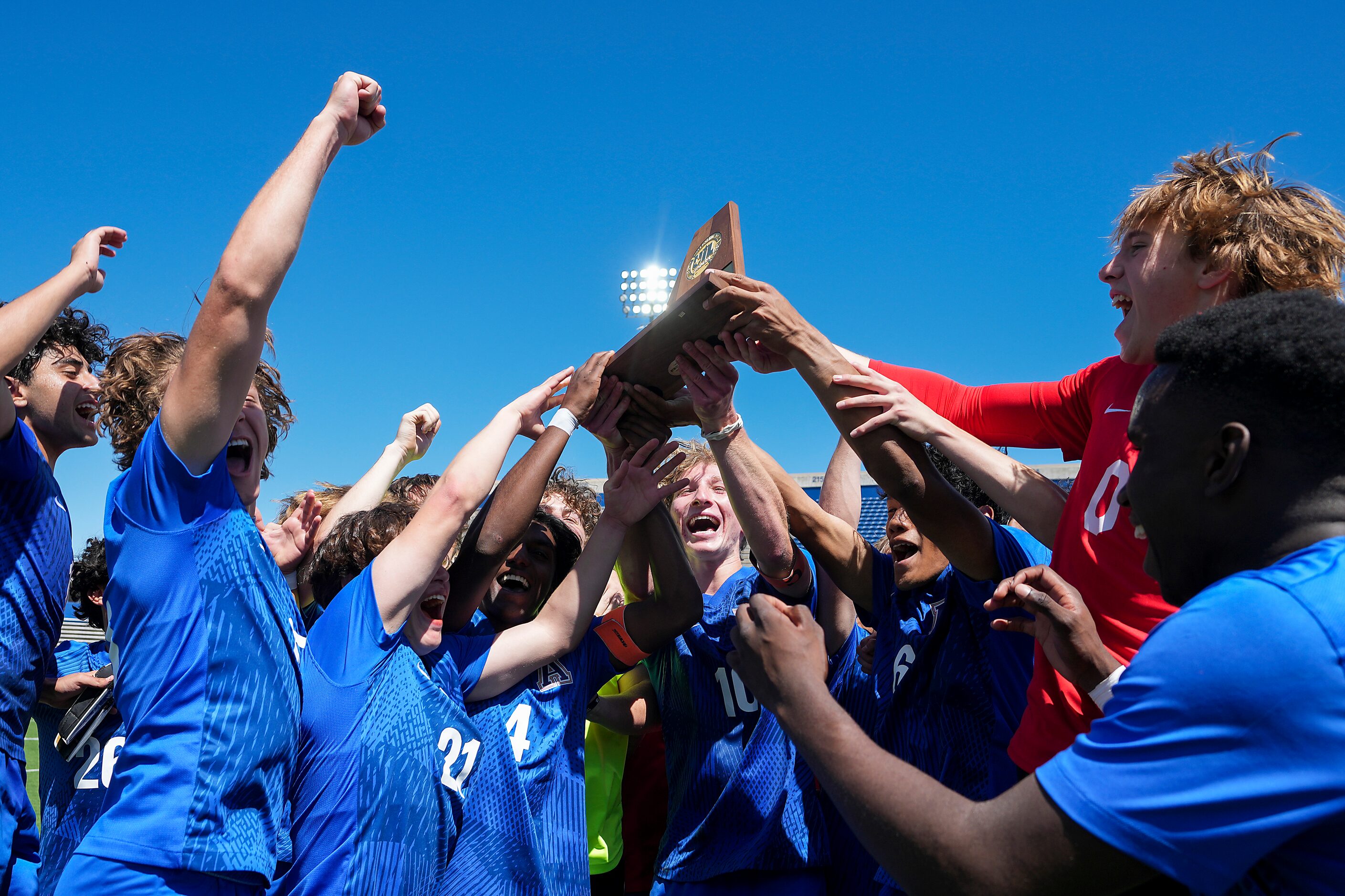 Allen players celebrate a shootout victory over Lake Highlands in the Class 6A Region I boys...