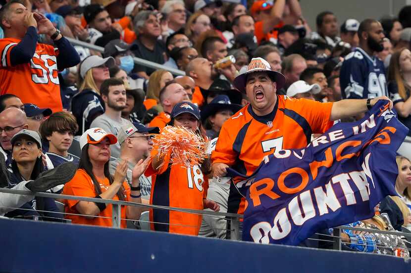 Denver Broncos fans cheer after a Broncos field goal during the second half of an NFL...
