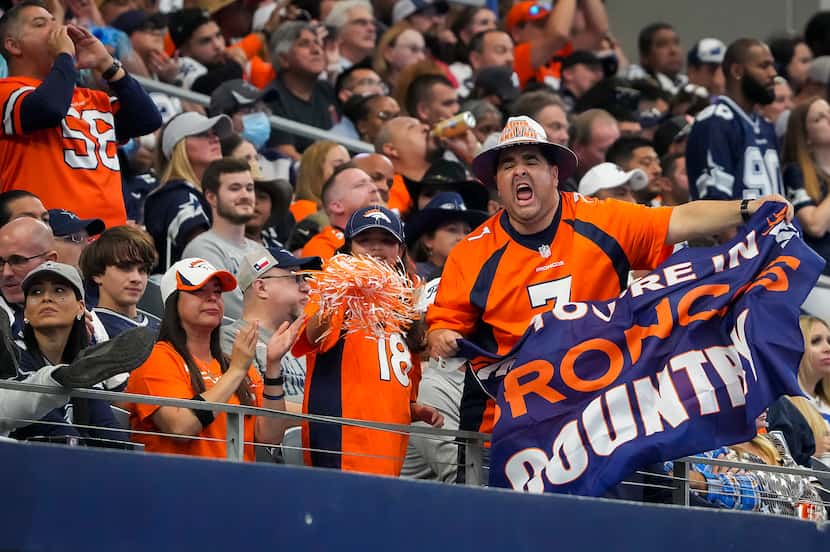 Denver Broncos fans cheer after a Broncos field goal during the second half of an NFL...