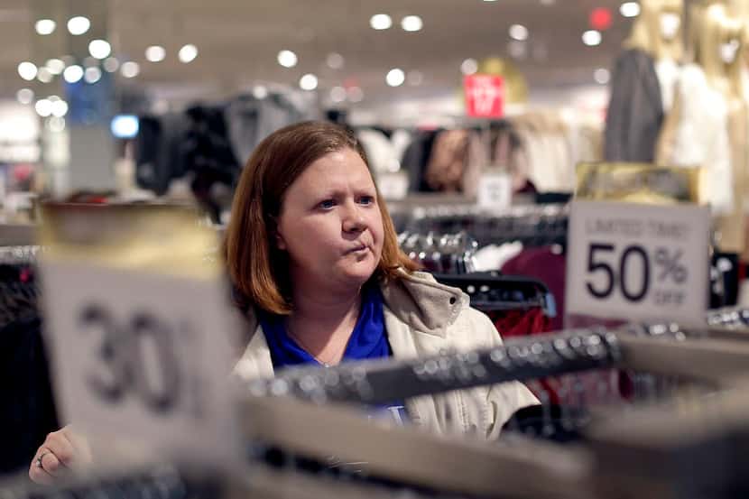In this Saturday, Nov. 28, 2015, file photo, Janae Melvin shops for gifts at Forever 21 in...