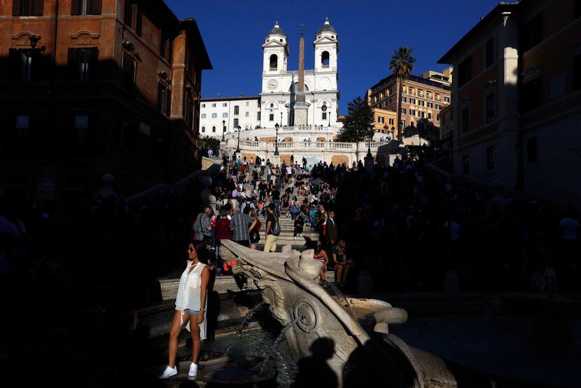 Tourists enjoy a sunny afternoon on the Spanish steps in downtown Rome. Europe never seems...