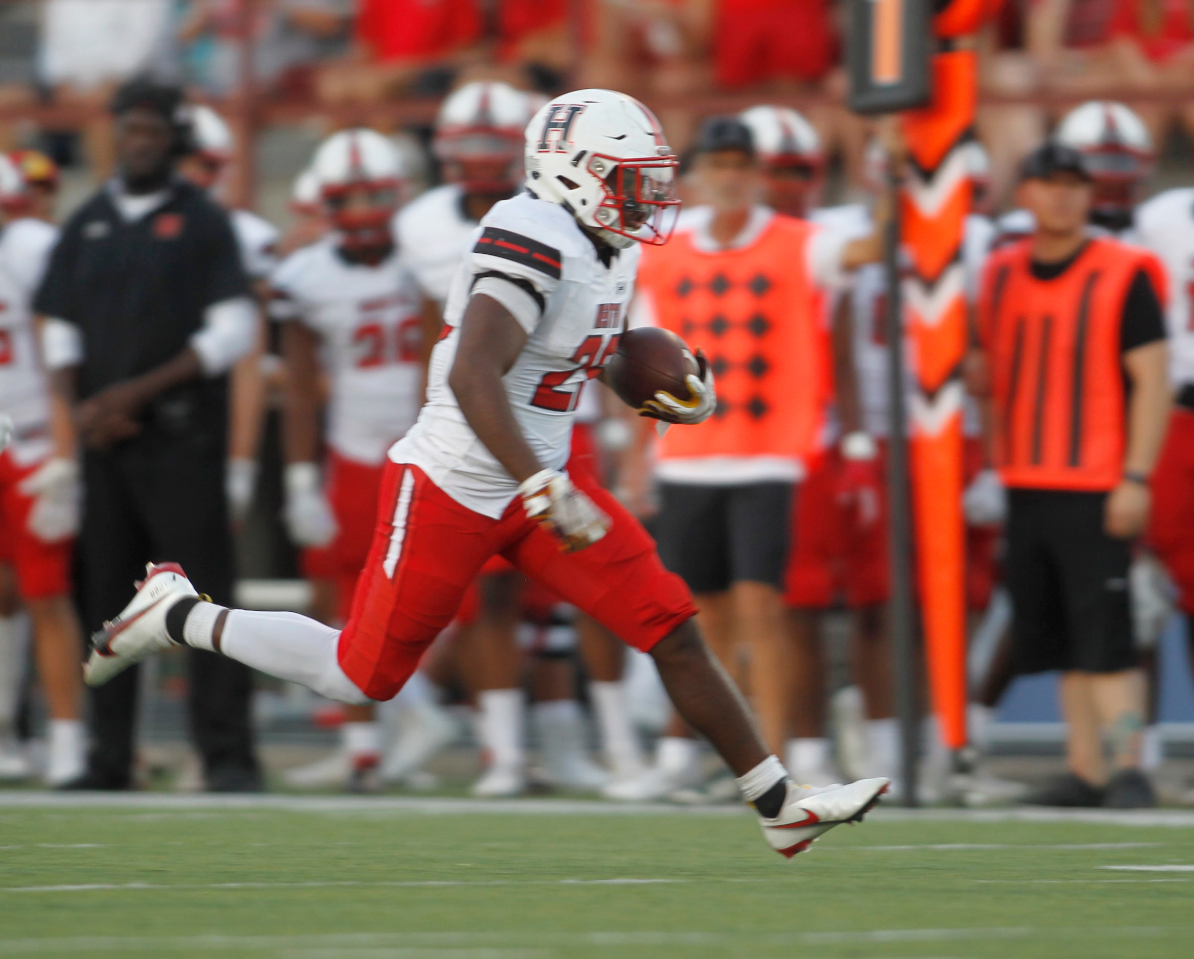 Rockwall Heath running back Zach Evans (26) rambles into the Red Oak secondary during a...