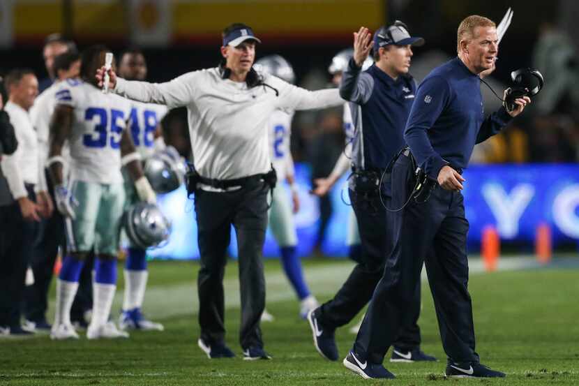 Dallas Cowboys head coach Jason Garrett and the Cowboys sideline argues a call during the...